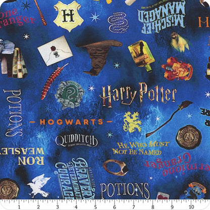 The Benartex Harry Potter Blue Words 108" Wide 3 Yard Quilt Fabric Back Pack features house crests, wands, broomstick, Hedwig, Potions, and Quidditch—ideal for quilt backing or Hogwarts-themed projects. Ruler shown for scale.