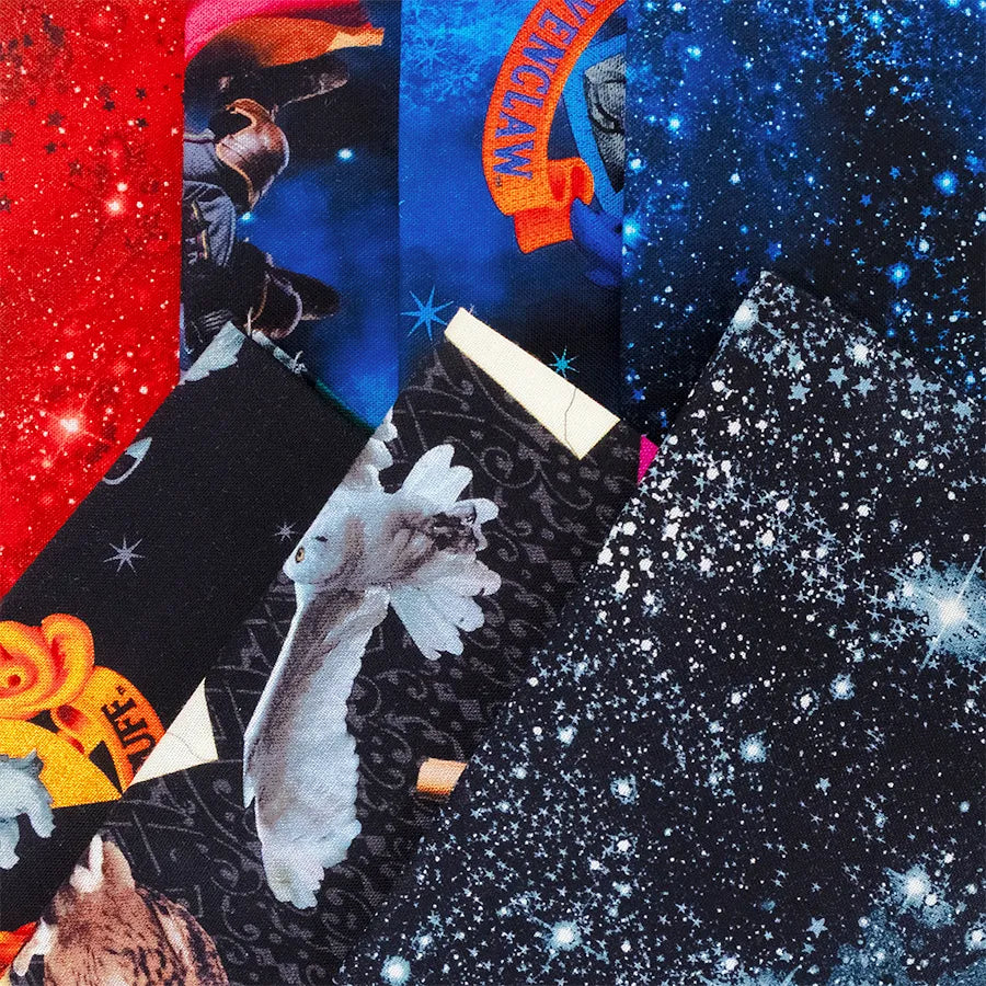 A close-up of Benartex's Harry Potter Fat Quarter Bundle shows overlapping fabric pieces with vibrant patterns—starry skies, red space motifs, animals, and partial text—ideal for creative fat quarters projects.