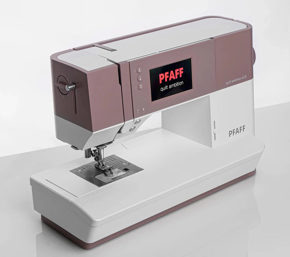 A Quilted Joy Pfaff Quilt Ambition 635 Sewing and Quilting Machine in white and mauve with Integrated Dual Feed Technology and a digital display, shown on a plain light background.