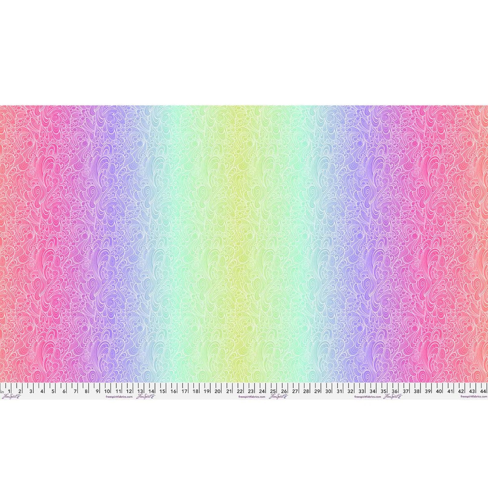 A pastel rainbow gradient with intricate white floral swirls, inspired by Jaftex - FreeSpirit's Floral Reef Deep Dive Riptide Fabric Yardage, features a ruler in inches and centimeters—ideal for quilting cotton projects.