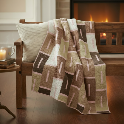 Blush and Burlap lap quilt draped over cozy furniture in a warm inviting room with meander quilting design