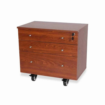 A wooden filing cabinet with three drawers, silver handles, a locking top drawer, and four black caster wheels—perfect for storing supplies next to your Quilted Joy Kangaroo & Joey XL Sewing Cabinet (available in 3 colors).
