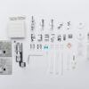 An assortment of hardware and small parts for the JANOME Continental M7 Professional: PRE-LOVED by Quilted Joy, neatly organized on a white background. Includes screws, brackets, anchors, wall plates, wires, and installation guides.