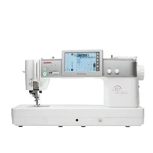 The Quilted Joy JANOME Continental M7 Professional: PRE-LOVED is a modern white sewing machine with a large touchscreen, multiple buttons and knobs, and the largest sewing area for a professional experience.