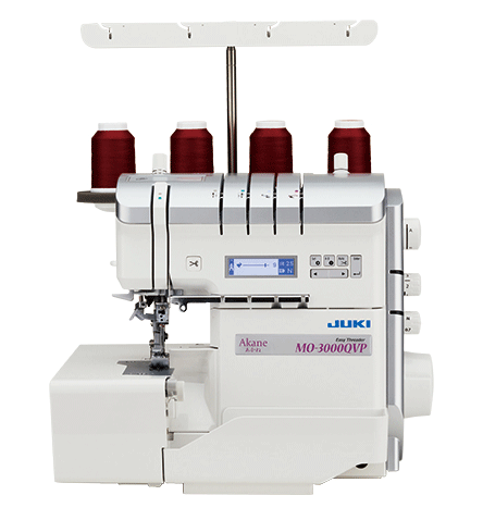 The JUKI Akane MO-3000QVP air threading serger photographed from the front with four thread cones on its telescoping stand and the LCD screen lit.