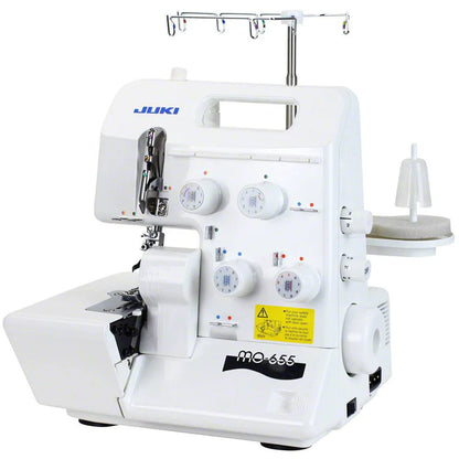 The Juki America Pearl Line MO-655 2/3/4/5 Thread Serger offers multiple thread tension dials, spools, and guides for professional overlock stitching.
