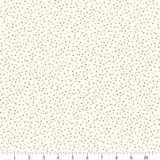 Norwegian Forest Cream Circle Dots Fabric Yardage by Jaftex - Henry Glass Fabrics features a cream base with small, regularly patterned green dots. A ruler in the image shows inch measurements for scale of this fabric print.