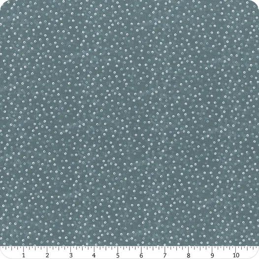 Norwegian Forest Medium Blue Circle Dots Fabric Yardage by Jaftex - Henry Glass Fabrics features a textured blue-gray design with scattered small white and medium blue dots. A white ruler runs along the bottom edge, showing 0 to 12 inch measurements.