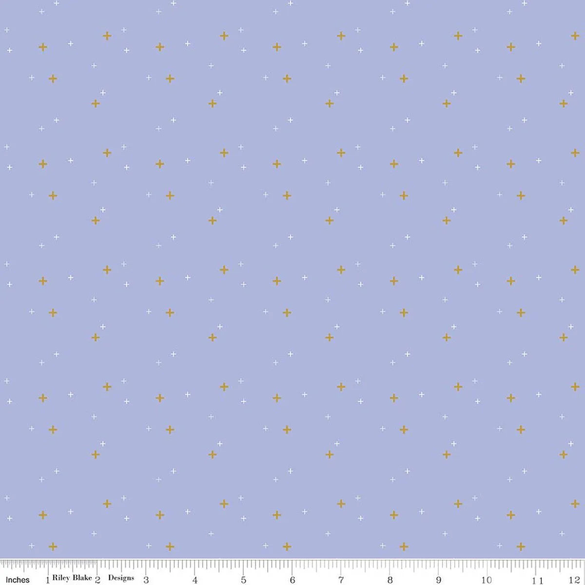 Sparkler Periwinkle Fabric Yardage by Riley Blake is a pale lavender 100% cotton fabric with small gold and white plus signs evenly scattered. A ruler along the bottom edge shows inches for measurement.