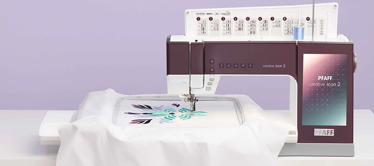 Pfaff Creative Icon 2 product image with fabric in embroidery arm