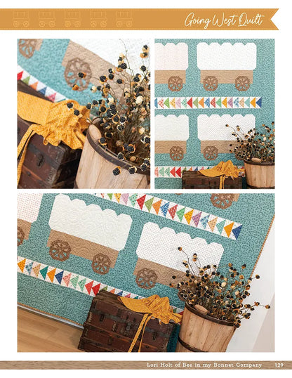 The Prairie Home Quilt Book by Checker Distributor, featuring covered wagon designs and colorful triangles inspired by Lori Holt’s style, is displayed with a wooden barrel of dried flowers and a vintage suitcase.