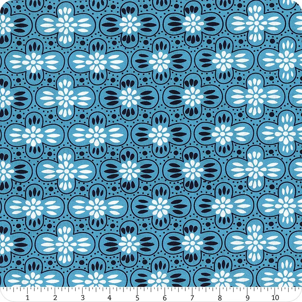 Pretty Things Deep Cottage Stripe 108" Wide 3 Yard Quilt Fabric Back Pack features blue fabric with stylized black and white floral patterns in rows. A ruler at the bottom shows inch measurements for easy scale reference.