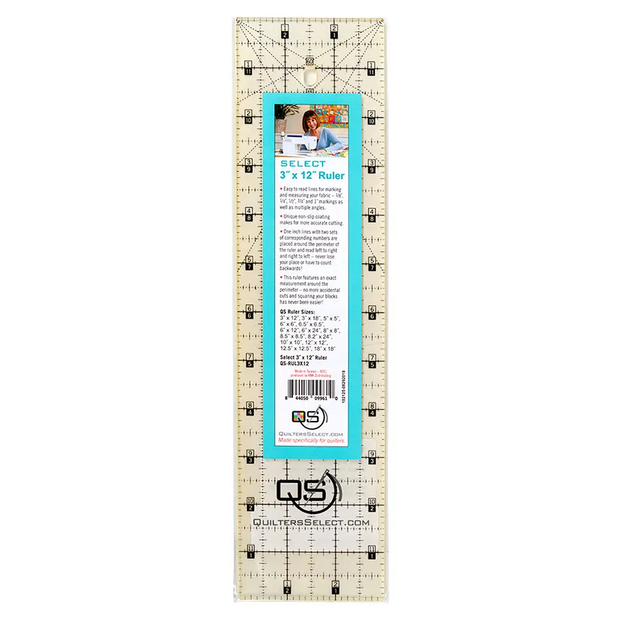 The Quilters Select Precision Machine Quilting Ruler 3in x 12in by Checker Distributor features black grid lines, clear numbers, a center info label with barcode, and a non-slip design for precise fabric measuring in quilting projects.