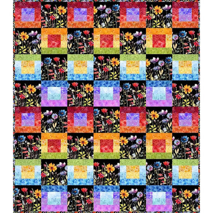 Brighten your space with the Quilted Joy Blooming Night Strip Quilt Kit, featuring colorful squares in red, orange, yellow, green, blue, and purple alongside black squares blooming with vibrant florals on a black background.