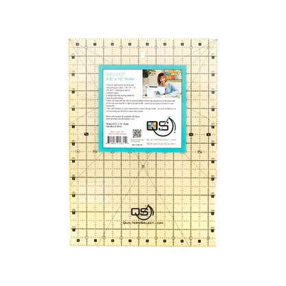 The Checker Distributor Quilters Select Non-Slip Ruler 8-1/2in x 12in features black gridlines, numbers, and angle markings. Its clear surface and non-slip design are highlighted on the packaging with branding, info, QR code, and usage image.