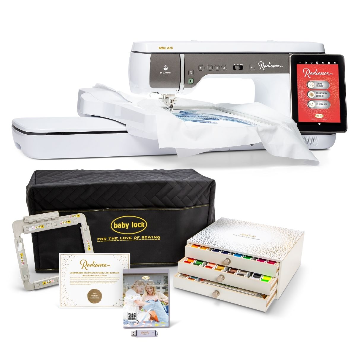 A Baby Lock Radiance Sewing & Embroidery Machine by Baby Lock is displayed with a digital screen, accessory bag, embroidery hoops, manuals, USB stick, and an organized box of colorful thread spools.