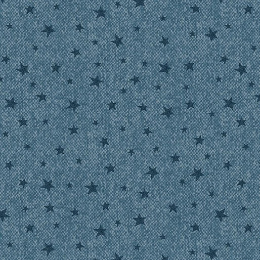 Blue textured background with scattered dark blue stars in various sizes creates a playful night sky effect, making Wooly Stars Blue Fabric Yardage perfect for creative sewing projects.