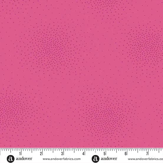 Spritz Flamingo Fabric Yardage by Andover features a pink quilting fabric with a subtle dotted pattern. A white ruler with inch markings and the Andover logo appears along the bottom edge.
