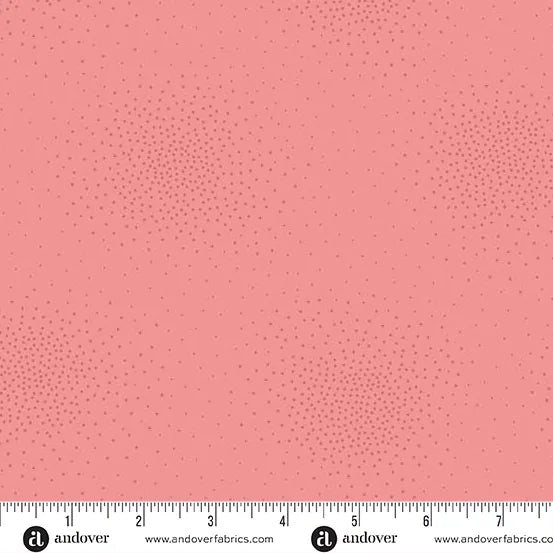 Spritz Cherry Blossom Fabric Yardage by Andover is a pink quilting fabric with a subtle dotted pattern. A ruler at the bottom edge shows inches for scale, highlighting the design's size.