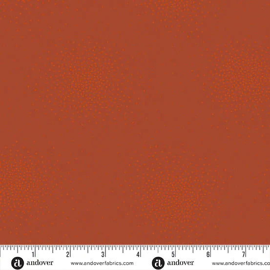 Spritz Autumn Fabric Yardage by Andover features rusty orange quilting fabric with small, subtle lighter dots. Includes a ruler along the bottom edge (1–8 inches). Ideal for your next autumn project.