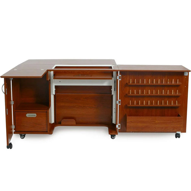 The Quilted Joy Kangaroo Wallaby Sewing Cabinet Set (available in 2 colors) is a mobile, wooden L-shaped unit with open doors revealing shelves, storage compartments, and a pull-out drawer for organizing sewing supplies.