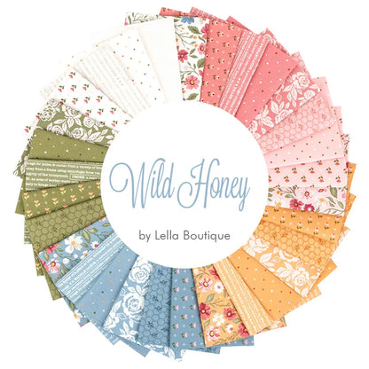 A circle of vibrant fabric swatches showcases the Wild Honey Fat Quarter Bundle by United Notions, featuring floral and geometric prints in pink, yellow, blue, green, and white.