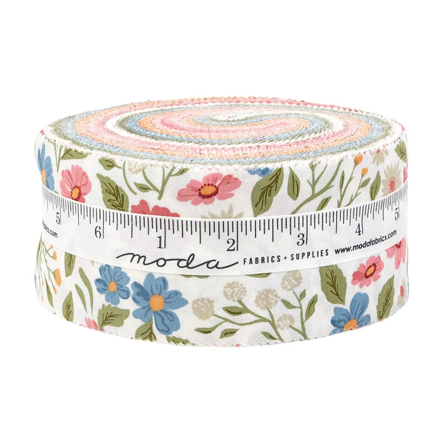 The Wild Honey Jelly Roll by United Notions is a bundle of precut fabric strips in floral pink, blue, and green, wrapped in a white ruler-printed ribbon—ideal for quilting strip projects.