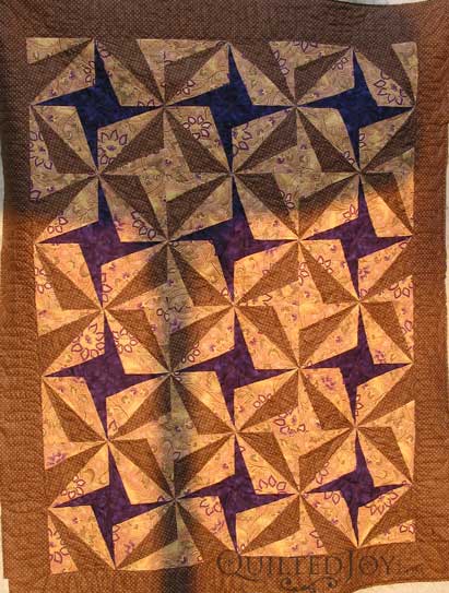 Sarah's Purple Pinwheels, quilted by Angela Huffman