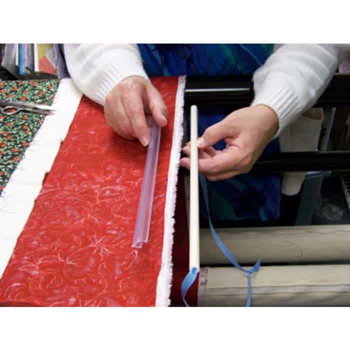 Image of a person using Leader Grips Side Grips on a quilt
