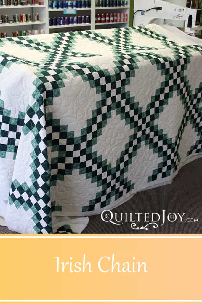 Irish Chain Quilt with shamrock edge to edge quilting by Angela Huffman - QuiltedJoy.com