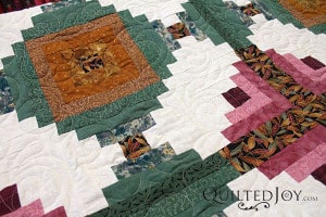 Imogene's Log Cabin Variation with the Splash of Love pantograph. Longarm quilting by Angela Huffman - QuiltedJoy.com