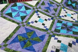 Longarm quilter Angela Huffman added a simple meander to Karee's two sampler quilts.
