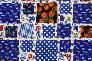A sporty quilt for a University of Kentucky super fan! Quilting by Angela Huffman with the Pinched Square Spiral pantograph.