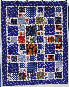 A sporty quilt for a University of Kentucky super fan! Quilting by Angela Huffman with the Pinched Square Spiral pantograph.