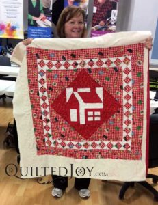 Schoolhouse block on a charity quilt for kids in need.
