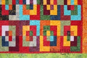 Once Around the Block quilt, quilted by Angela Huffman using the Pipeline Pantograph