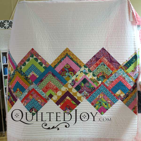 Angela Huffman at APQS dealer assisted renter Erin with her rinse and repeat quilt, modern log cabin quilt