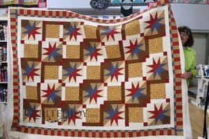 Beverly's variation on a 54-40 or Fight quilt block looks great with the Bountiful Feathers quilting design!