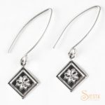 Lemoyne Star sterling silver earrings on long wire from Siesta Silver Jewelry. Available at QuiltedJoy.com