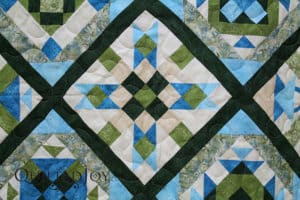Karee put her blocks on point for a fresh take on a sampler quilt. Quilted by Angela Huffman