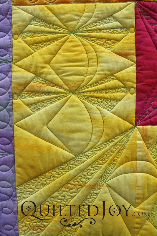 A high loft wool batting makes the quilt appear to pop up around the quilting lines.