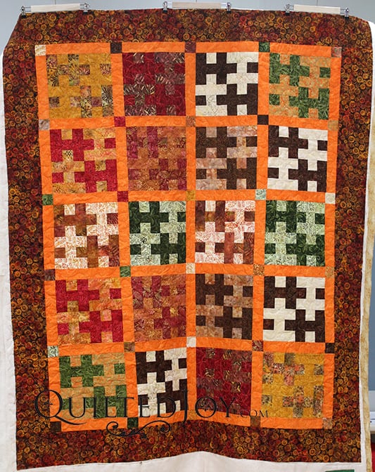Susan's quilt is a tessellating design made entirely of batiks. I quilted it with a neutral thread that blends well and a meandering design. Fun!