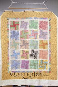 Susan's floral rail fence quilt has me dreaming of spring! Her busy fabrics needed a simple quilting design that would let the piecing sing!