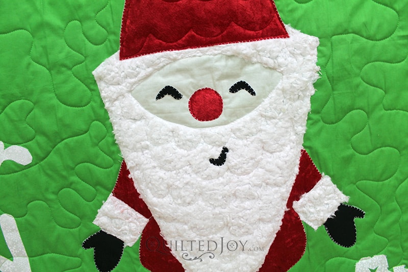 Valerie designed this adorable Santa wallhanging quilt herself! She said it was inspired by a Christmas card.