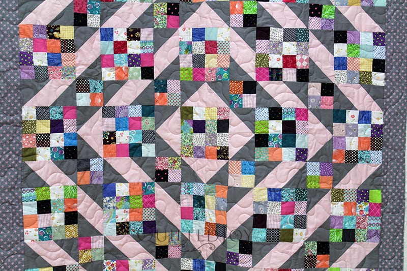 Anita took the Sunny Skies Quilt pattern and made it her own! She brought this super cute scrappy quilt to Angela Huffman for some simple meander quilting.