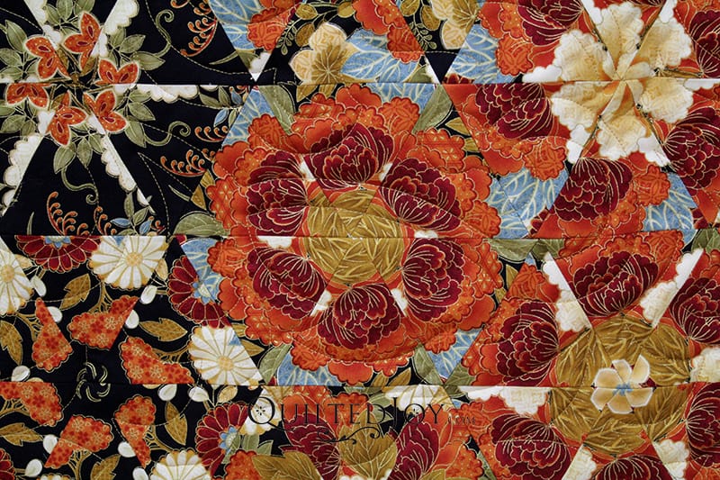 Judy asked me to quilt her beautiful One Block Wonder Quilt with a floral edge to edge quilting design. Take a look at how I quilted this gorgeous quilt.