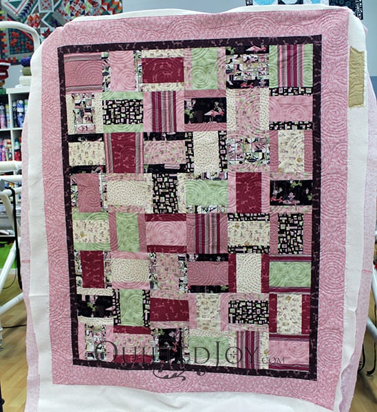 Lynn's Modified Rail Fence quilt with fun kitty fabrics