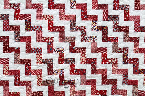 Split rail fence is a classic quilt pattern with many variations. The individual block consists of a set of stripes. The blocks are then arranged in a variety of ways to create different patterns.