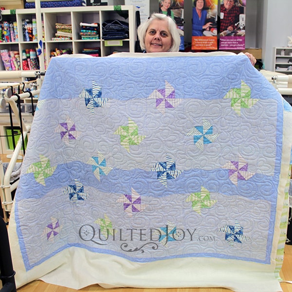 The pinwheels in Karen's quilt seem to float in the sky on her quilt!