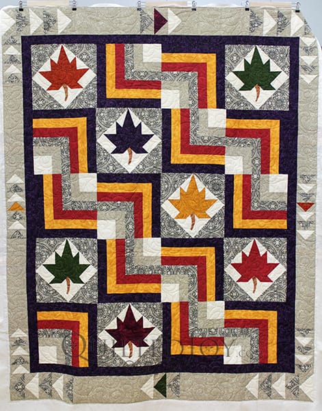Courtney asked me to quilt her gorgeous Leaf Block quilt. I can tell she had lots of fun playing with color, finding the perfect contrast of bold and neutral. She asked me to quilt this with a swirly edge to edge design that balanced the structured rigidity of her quilt.